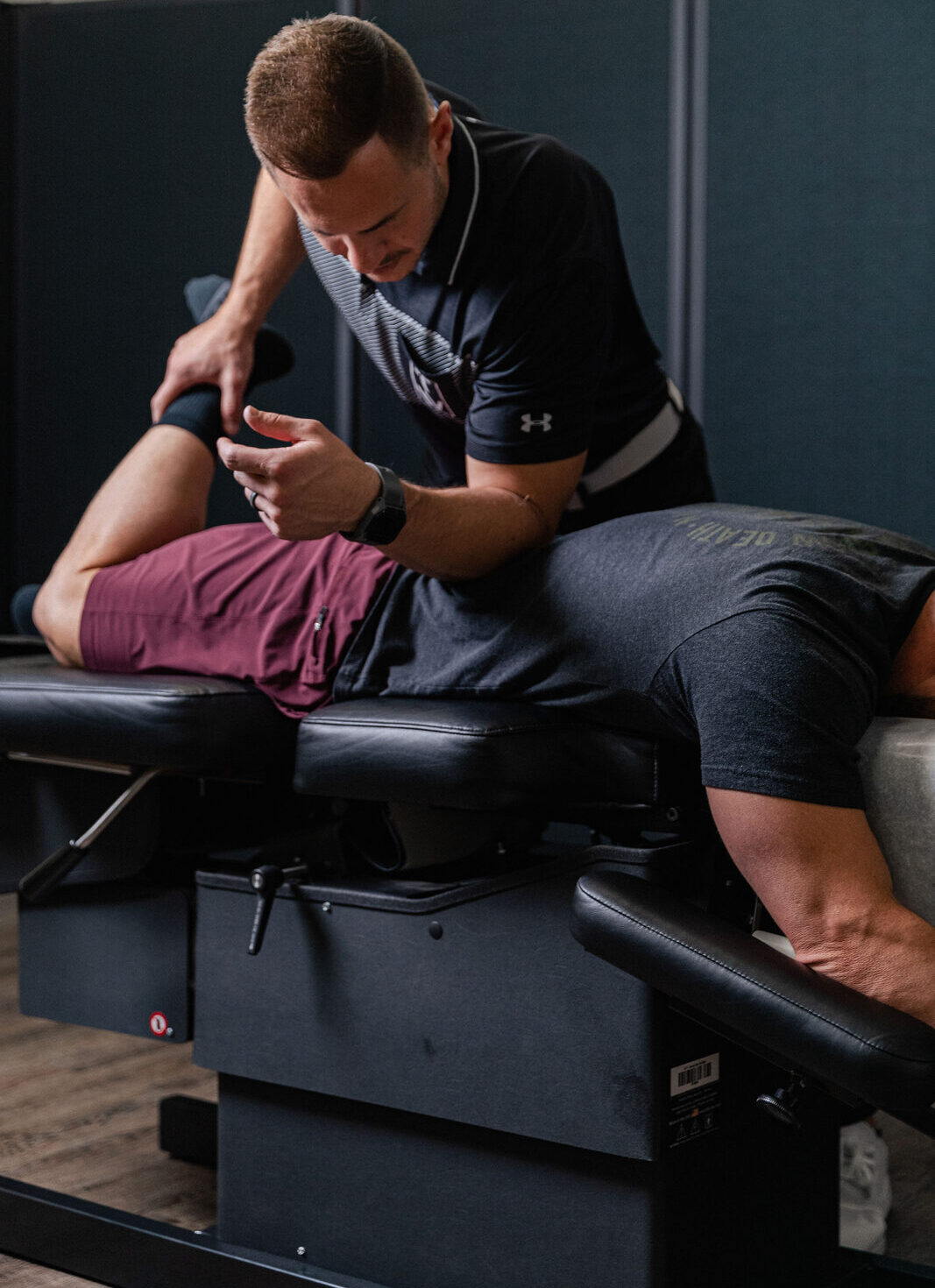 Hands-on hip and leg treatment at Transform Wellness