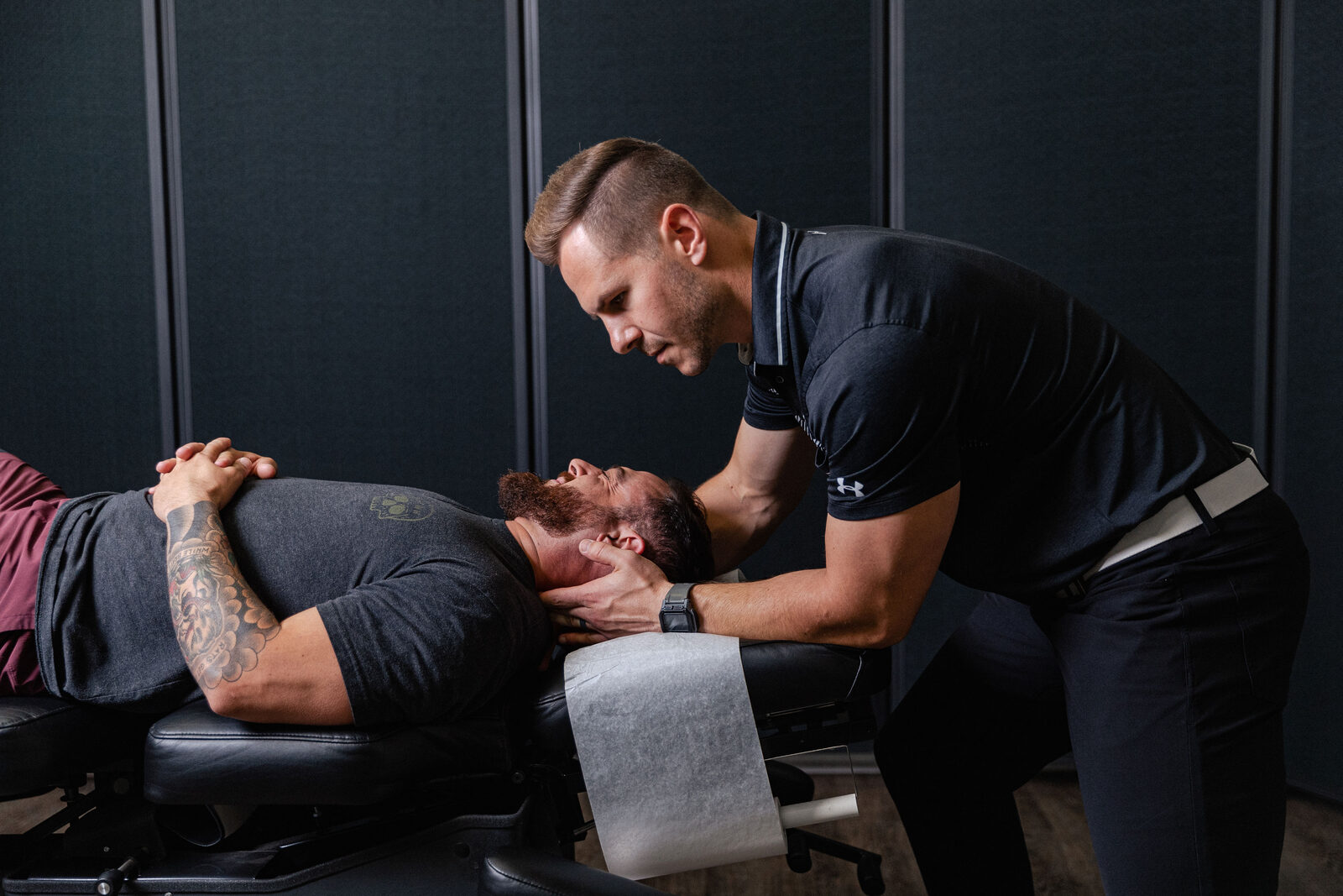 Chiropractor giving focused, attentive hands-on care to a patient at Transform Wellness